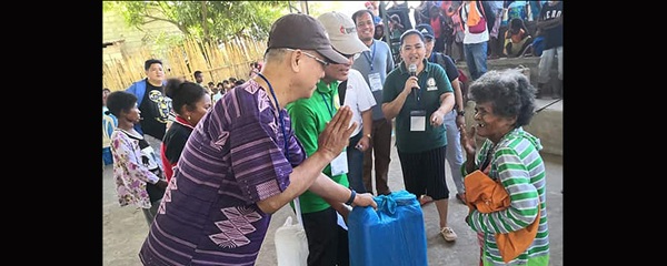 UMCOR aids indigenous earthquake survivors Manila Area Bishop Ciriaco Q. Francisco (left) and Jestril Alvarado, West Pampanga District superintendent, help distribute food to Aeta communities in Floridablanca in the Pampanga province of the Philippines. The United Methodist Committee on Relief issued a $100,000 grant to provide support for 860 indigenous families affected by a deadly earthquake.