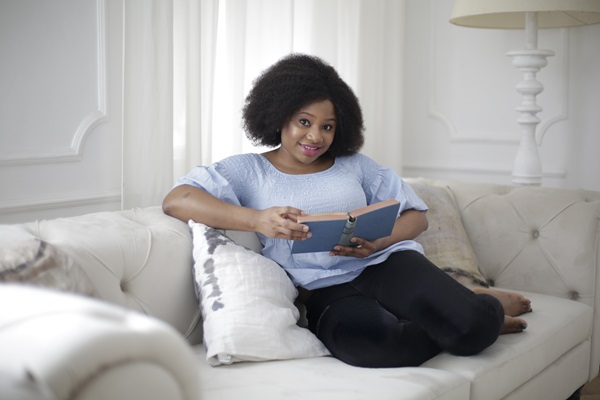 Experts tell us that reading books is a healthy way to calm ourselves and combat anxiety. Photo by Andrea Piacquadio from Pexels
