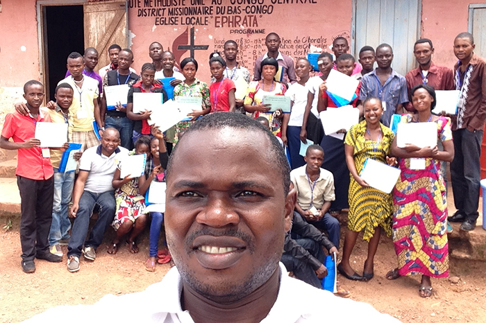Omadjela, poses with fellow classmates for photo opportunity.