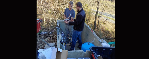 Advance Jubilee Water Project provides water to mountain homes Two senior mechanical engineering students, Sterling Burnett (short-sleeves) and Jonathan Wyatt (long sleeves) install a water treatment system that includes filtration, Ultraviolet Light disinfection, and activated carbon filtration to improve the water quality for the community at Cedar Grove spring.