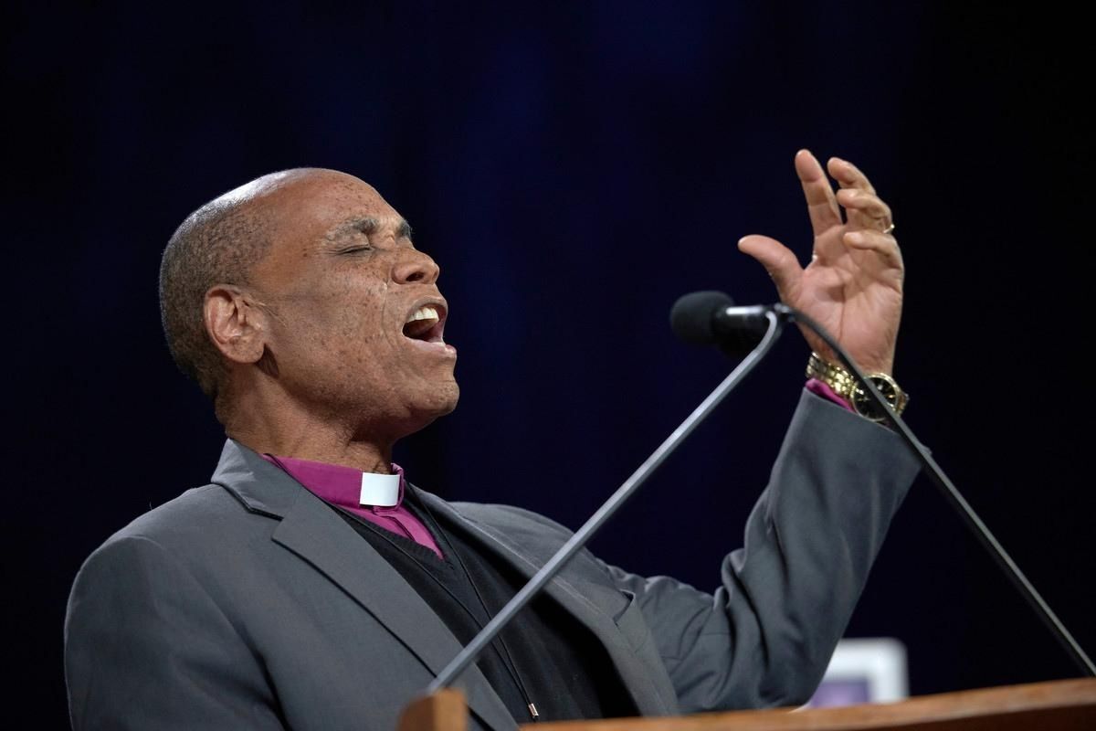 Bishop Eben K. Nhiwatiwa prays during the February 23, 2019, opening session of the Special Session of the General Conference of The United Methodist Church.  (Photo by Paul Jeffrey, UMNS.)