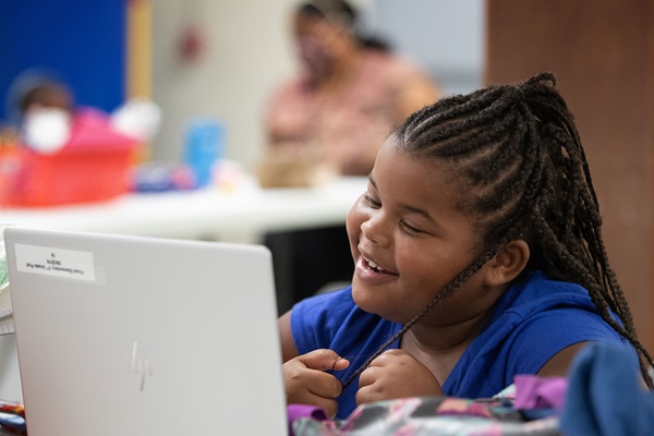 A first grade student interacts with her teacher and classmates by computer during the first day of the Sanctuaries of Learning program at Jones Memorial United Methodist Church at Crestmont Park in Houston. The program, started by the Texas Conference of The United Methodist Church, offers a safe space, internet access and other resources in area churches, allowing parents to return to work and their children to continue their education during the COVID-19 pandemic. Photo by Mike DuBose, UM News. Kids are good at masking their feelings under smiles, play and silliness. A simple ritual with a can of pop will help us help them. Photo by Mike DuBose, UM News.
