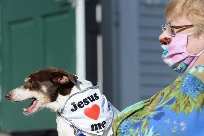 Nadean Yasko with her dog, "Rupert," during a service for the Blessing of Animals at Pearl Street United Methodist Church in Brockton, Mass., on Oct. 24, 2020. (Marc Vasconcellos/The Enterprise)