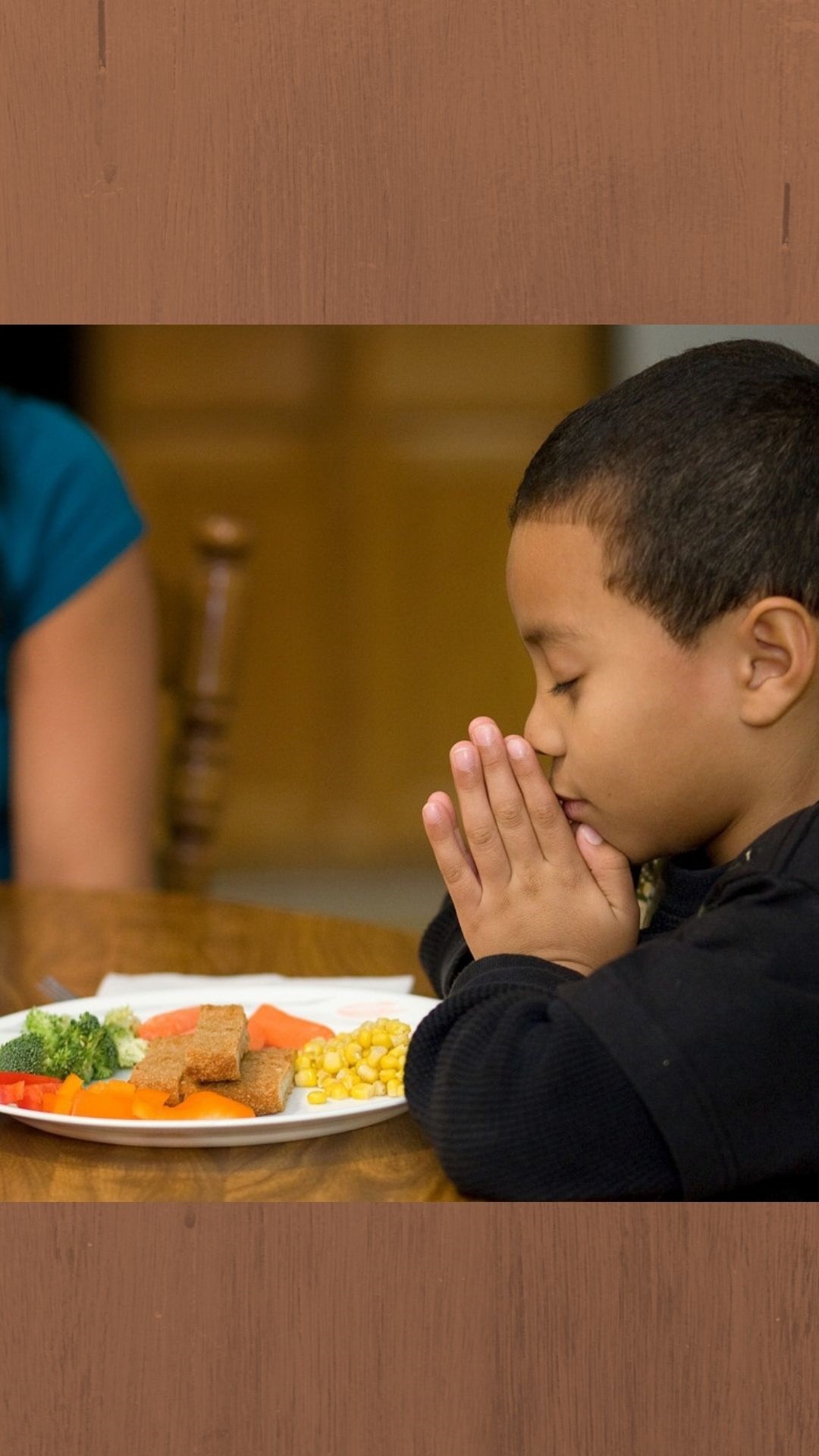 Geoffrey Booker, 6, prays before mealtime at his home in Brentwood, Tenn. Photo by Mike DuBose, UMNS [Adaption for UMC.org homepage hero]