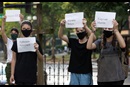 Supporters gather in the courtyard of McKendree United Methodist Church in Nashville, Tenn., during a prayer vigil to grieve and remember people lost to acts of racism. They are holding signs with the names of victims of racial violence. Photo by Mike DuBose, UM News