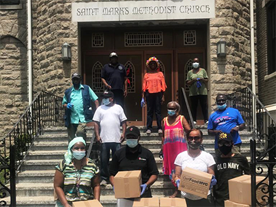  Volunteers at St. Mark’s UMC ready the table for distribution. Photo: courtesy St. Mark’s UMC