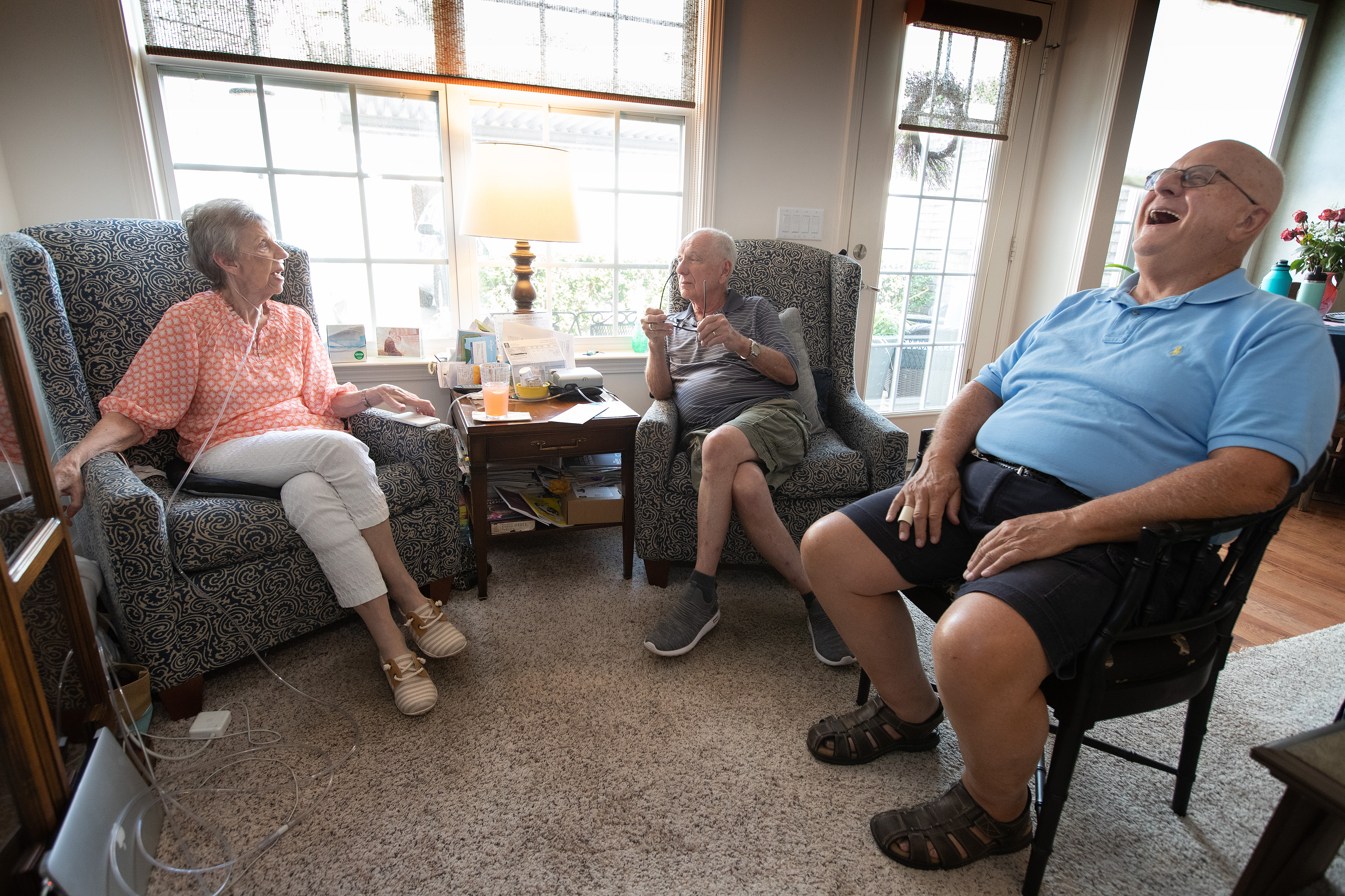 Frank Luchsinger laughs at an exchange between Janet Gray and Dave Allen during a visit at Gray’s home in Franklin, Tenn. The two men, both of whom outlived their wives, spend their Tuesdays together, visiting church members on the prayer list at Brentwood (Tenn.) United Methodist Church. Photo by Mike DuBose, UM News.