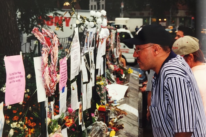 A man looks at memorials in New York City following the terrorist attack on 9/11, photo by Jenn Rodia