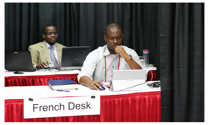 Isaac Broune and Joe Tueche Ndzulo handle the French desk during the 2016 United Methodist General Conference in Portland, Ore. Photo by Kathleen Barry, United Methodist Communications Kathleen Barry