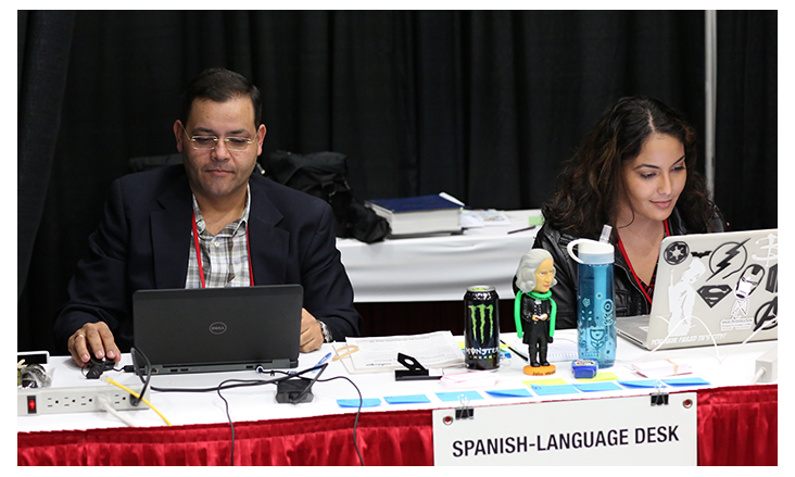 Gustavo Vasquez and Michelle Maldonado work at the Spanish-language desk during the 2016 United Methodist General Conference in Portland, Ore. Photo by Kathleen Barry, United Methodist Communications Kathleen Barry