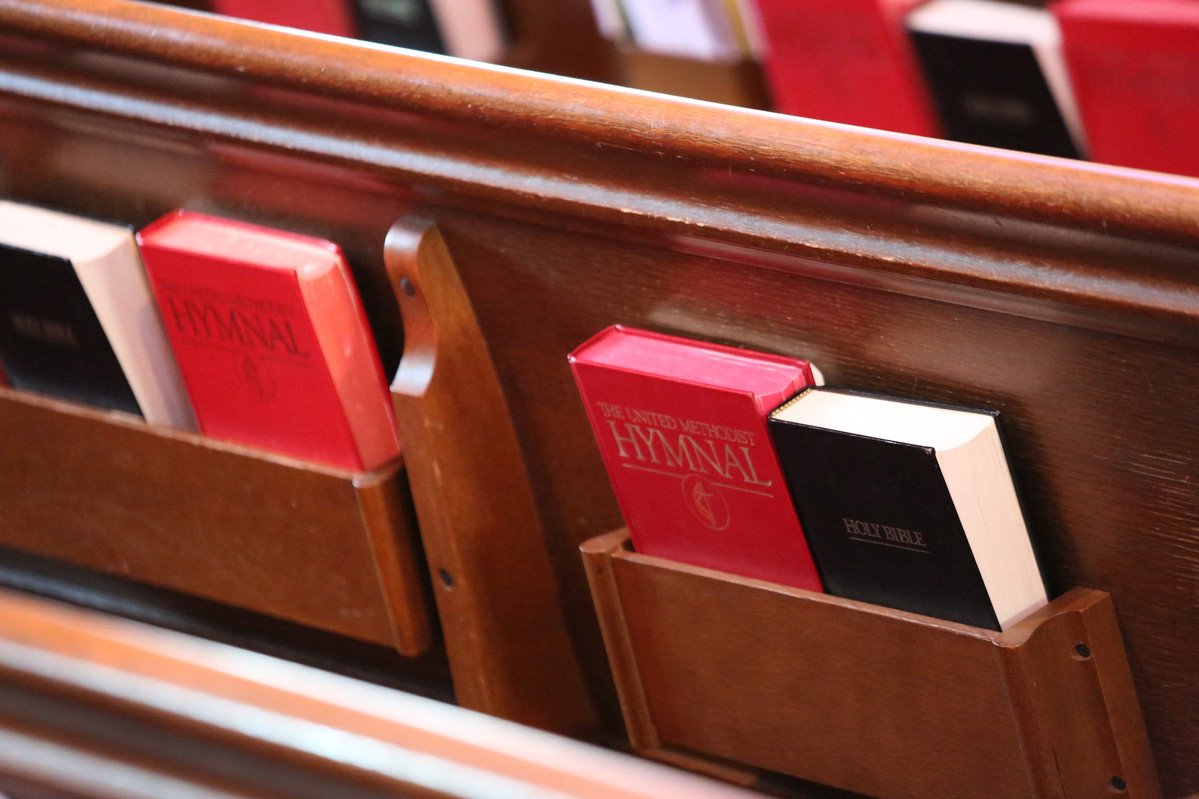 Books in pews at West End United Methodist Church. Photo by Steven Adair