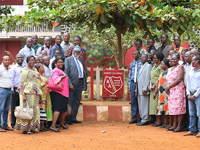 United Methodist Bishop Warner Brown (to the left of sign, middle row) poses with staff of the Albert Academy boys’ high school in Freetown, Sierra Leone, during a familiarization tour of United Methodist institutions in the country. Brown was appointed as interim bishop of the Sierra Leone Episcopal Area following the death of Bishop John K. Yambasu in 2020. Photo by Phileas Jusu, UM News.