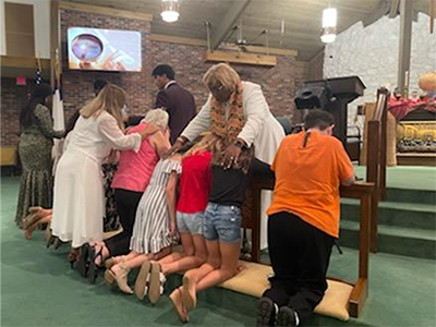 The different campus pastors prayed over those who came to the altar. Courtesy photo.