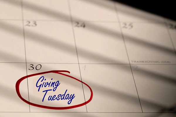 Unlike Black Friday and Cyber Monday, which are focused on purchasing for oneself, Giving Tuesday emerged as a way to encourage generosity to benefit the lives of others. Photo illustration by Mike DuBose, United Methodist Communications.