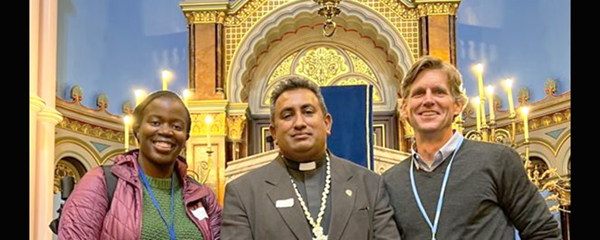 GBCS staff members Laura Kigweba James, left, and John Hill, right, with the Rev. James Bhagwan, a Methodist minister from Fiji, at a COP26 interfaith service and dialogue Oct. 31 at Garnethill Synagogue in Glasgow. GBCS staff members Laura Kigweba James, left, and John Hill, right, with the Rev. James Bhagwan, a Methodist minister from Fiji, at a COP26 interfaith service and dialogue Oct. 31 at Garnethill Synagogue in Glasgow.