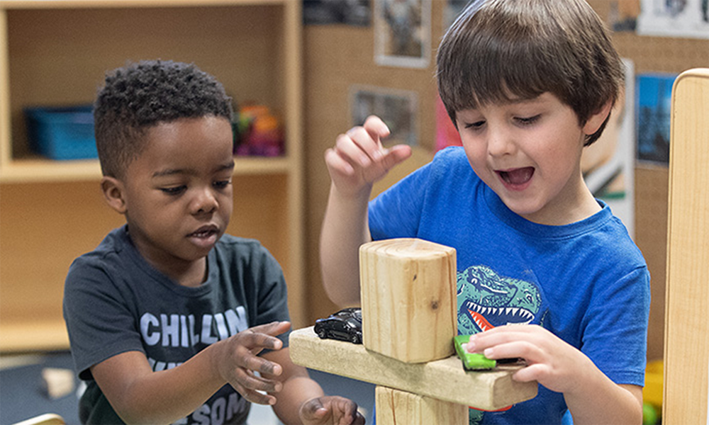 Daycare students Michael (left) and Aiden play together at Bethlehem Centers. Photo by Mike DuBose, UM News.