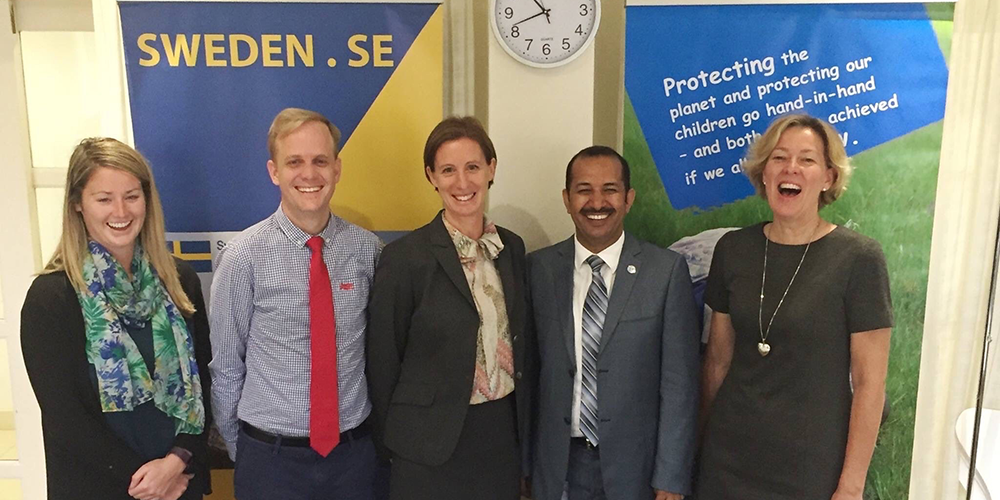 Dr. Gareth poses with group at Swedish Embassy. Courtesy photo.