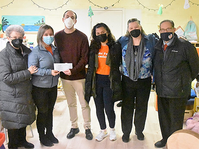 St. John’s UMC Ivyland’s pastor the Rev. Brad Leight (3rd from left) and outreach ministries coordinator Ruth Portzline (left) present the church’s donation to Bright Future Academy administrator Jennifer Harmon in January, alongside (from center-left) El Mesias UMC treasurer Lucy Rivera, St. John’s media producer Sarah Floyd and El Mesias UMC pastor the Rev. Efrain Cotto.
