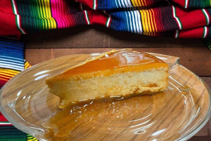 photo shows a slice of Bilha Alegria's Flan Napolitano on a table