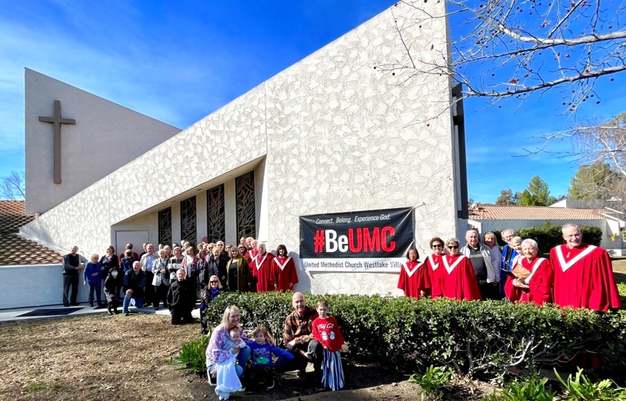 Members of United Methodist Church Westlake Village, Westlake Village, California pose in front of their #BeUMC sign. They received a grant from United Methodist Communications for the banner.