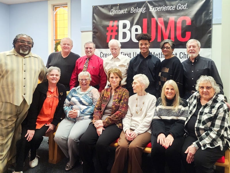 Members of Crescent First United Methodist Church, Crescent, Oklahoma pose in front of their #BeUMC sign.