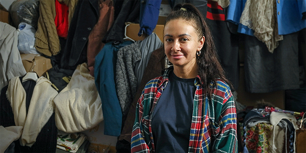 Natalia, a Ukrainian refugee, pauses as she sorts clothes at the CWS Balti Center in Moldova. She and her family have found “a warm hug” in this Moldovan community. Photo: Church World Service. Natalia, a Ukrainian refugee, pauses as she sorts clothes at the CWS Balti Center in Moldova. She and her family have found “a warm hug” in this Moldovan community. Photo: Church World Service.