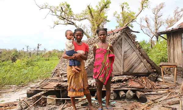A mother of two stands by the remains of her home, which was destroyed by Cyclone Freddy in the Mananjary district of Madagascar. Photo by Justin Rakotoarimanana. A mother of two stands by the remains of her home, which was destroyed by Cyclone Freddy in the Mananjary district of Madagascar. Photo by Justin Rakotoarimanana.
