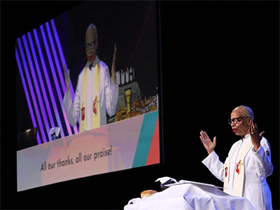 Bishop Tracy S. Malone blesses the communion elements during a service at the East Ohio Annual Conference on June 8. Malone is the convener of the joint task force that brought together members of the Standing Committee on Central Conference Matters, the Connectional Table and developers of the Christmas Covenant.