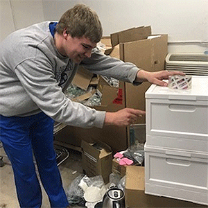 Checking out the supplies on hand. Photo by Rev. Linda Baldock.