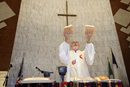 Bishop Joel Martínez blesses the elements of Holy Communion during opening worship at the 2011 MARCHA meeting at the Lydia Patterson Institute in El Paso, Texas. Photo by Mike DuBose, UM News.