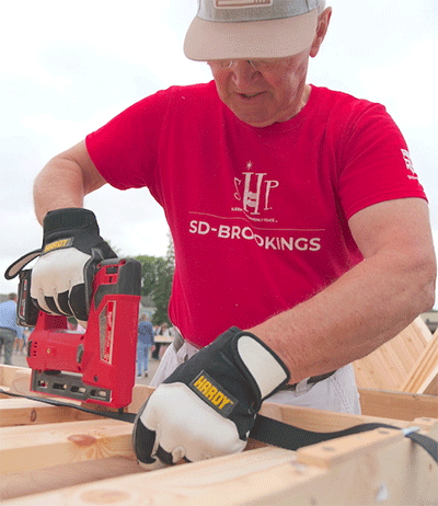 Charlie Schnabel demonstrates a stapling technique for the volunteers. Courtesy photo.