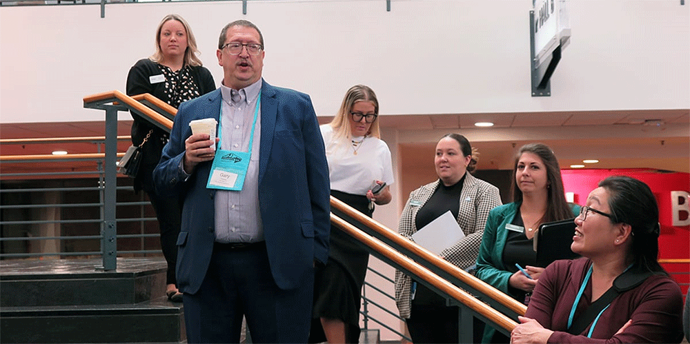 The Rev. Gary Graves, General Conference secretary, offers introductions ahead of a tour of the Charlotte Convention Center in Charlotte, North Carolina. Behind him are representatives of the convention center and the Charlotte Regional Visitors Authority. In front of him looking on is Elaine Moy of the United Methodist Commission on Religion and Race. General Conference is set to meet April 23-May 3 in the convention center. Photo by Heather Hahn, UM News.