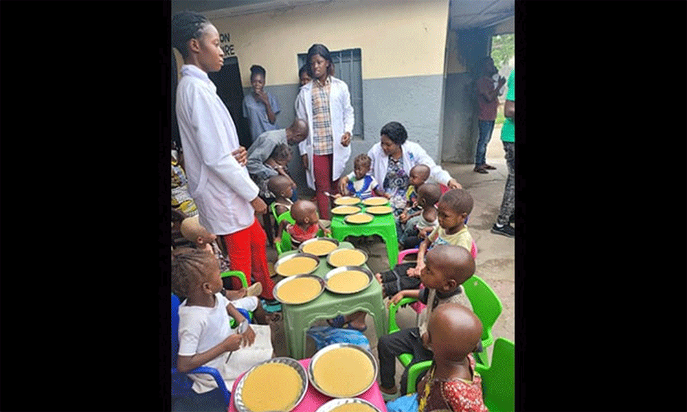 Children receive a porridge meal at Mangobo Methodist Hospital Center in Kisangani, Congo, while staff monitor them. In 2023, The United Methodist Church cared for more than 2,300 malnourished children in the region, include 771 with acute malnutrition. Photo courtesy of the Health Department of The United Methodist Church in Eastern Congo.