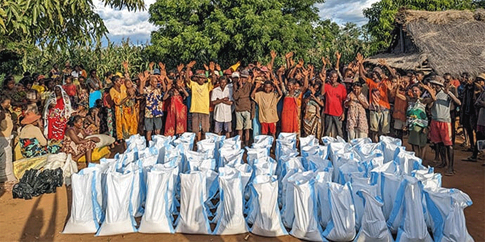 Community members from Andranokaky, Madagascar, celebrate the food and other supplies distributed by The United Methodist Church in Madagascar. Extended drought and flooding has created food insecurity in the region. Photo by Justin Rakotoarimanana.