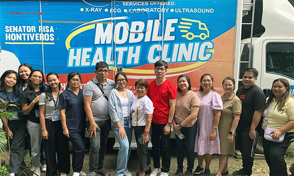 Members of the medical mission team pose in front the Mobile Health Clinic where X-rays and ultrasounds were done during a free health care outreach event at Spottswood Methodist Center in Kidapawan, Philippines, June 21-22. Photo courtesy of Davao Episcopal Area Communications.