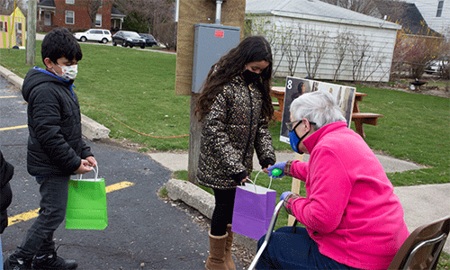 Dearborn: First UMC adopted a family from Jordan as part of their new Response Team ministry, partially funded by a Mustard Seed Migration Grant. The congregation makes sure the family is included in all events and activities. Here, Ahmad and Fatima attend an outdoor Easter StoryWalk and egg hunt. ~ photo courtesy Kristin Karoub