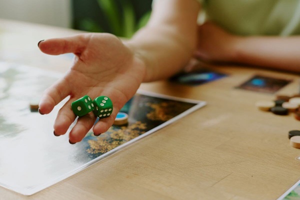 tabletop-game-rolling-dice What can tabletop games teach the church about inclusion and hospitality?