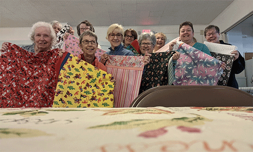 Oakdale UMC volunteers showcase pillowcases before delivering to children with cancer. Courtesy photo.
