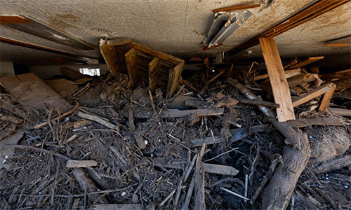 Debris caused by Hurricane Helene’s floodwaters fills the fellowship hall to within inches of the ceiling at Pensacola United Methodist Church in Burnsville, N.C. (Photo: Mike DuBose, UM News)