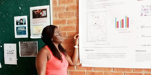 Martha Fatoma, from Sierra Leone, reads the College of Health, Agriculture and Natural Science (CHANS) billboard at Africa University in Zimbabwe. Fatoma is a World Communion Scholar who studied at Africa University for a Bachelor of Science in Nursing. Photo: Courtesy of Martha Fatoma Martha Fatoma, from Sierra Leone, reads the College of Health, Agriculture and Natural Science (CHANS) billboard at Africa University in Zimbabwe. Fatoma is a World Communion Scholar who studied at Africa University for a Bachelor of Science in Nursing. Photo: Courtesy of Martha Fatoma