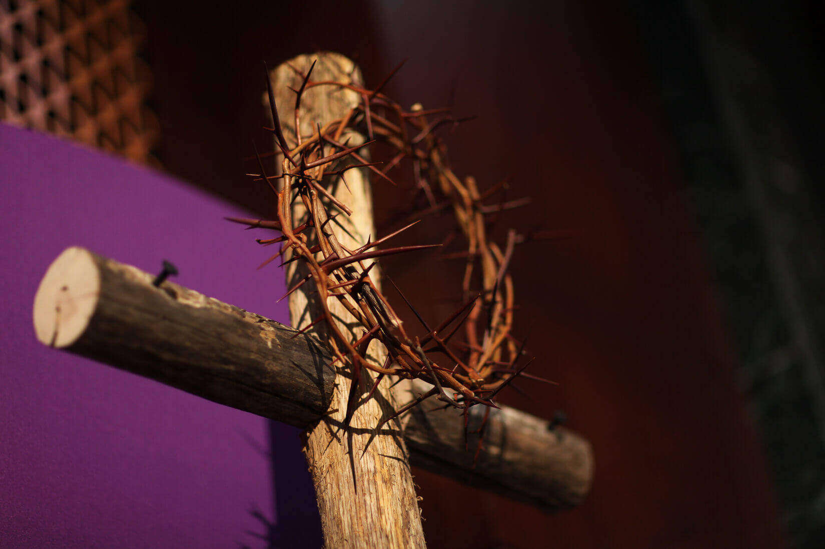A Lenten display- crown of thorns and cross with purple cloth herald the beginning of Lent. Photo by Kathleen Barry, United Methodist News Service
