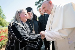 United Methodist Bishop Mary Ann Swenson greets Pope Francis in Geneva, Switzerland, in 2018, during the commemoration of the World Council of Churches’ 70th anniversary. The leader of the Catholic Church spoke about the significance of Catholic involvement in ecumenical work and pledged his commitment to the cause of Christian unity. United Methodists around the world are mourning Pope Francis, who died April 21 at age 88. File photo by Albin Hillert, World Council of Churches.