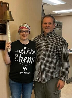The Rev. Natalie Justice rings the bell after her final chemo treatment as she faced cancer the second time.