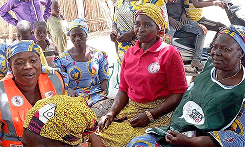Nurses Jemima Anthiah (left) and Maimuna Eliphaz (right) provide medications and counseling on proper health management to women at Yapilo Village in Gombe State on March 29. The free health services were organized by the Northern Nigeria Conference’s women’s organization. Photo by Ibrahim Babangida, UM News.