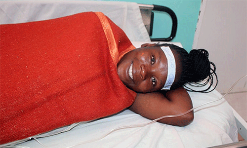 Caroline Checha, 26, from Zengeni Village Penhalonga, visits the Old Mutare Mission Hospital for a surgical procedure. Checha first came to the hospital in 2017 when she gave birth to twins. She was surprised and pleased with the upgrades. “The renovated theater is beautiful and modern.” Photo by Kudzai Chingwe, UM News.