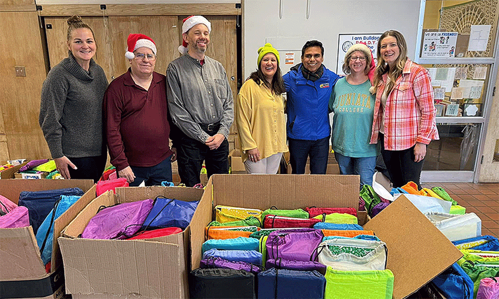 Volunteers pack school supplies for neighborhood school. Courtesy photo.