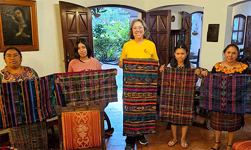 Lulu Ramirez (center) with a Quiche women's cooperative participating in the Guatemalan Methodist Church's microloan program to make traditional cloth for women. (Photo: Courtesy of L. Ramirez)