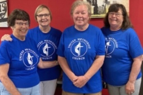 Three women from Oswego: Trinity UMC in New York gather for a community Bible study that has also become a community outreach initiative. 