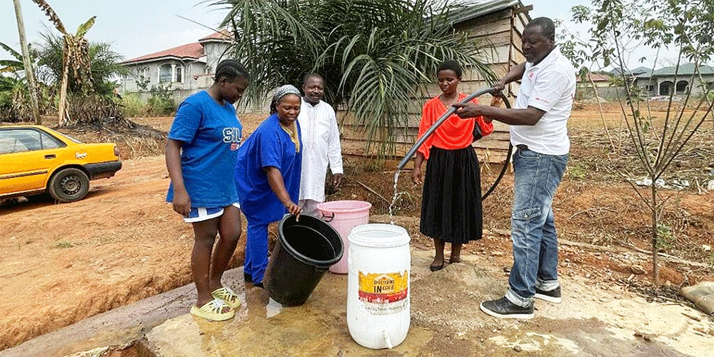 Community members learn how to use and maintain the new water pumping facility, Minkoameyos, Cameroon. Photo: UMC Cameroon.