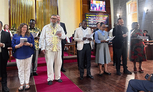 Newly commissioned missionaries in Nairobi, Kenya, recite the Wesleyan Covenant Prayer at Lavington United Church. (Photo: Susan Clark)